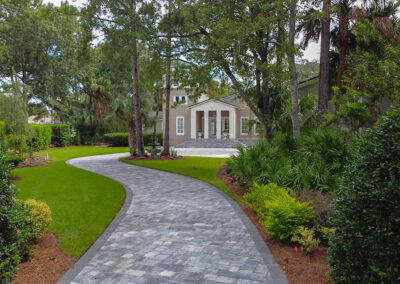 long curving paver driveway with accent border