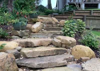 Natural stone stair steps up a hill